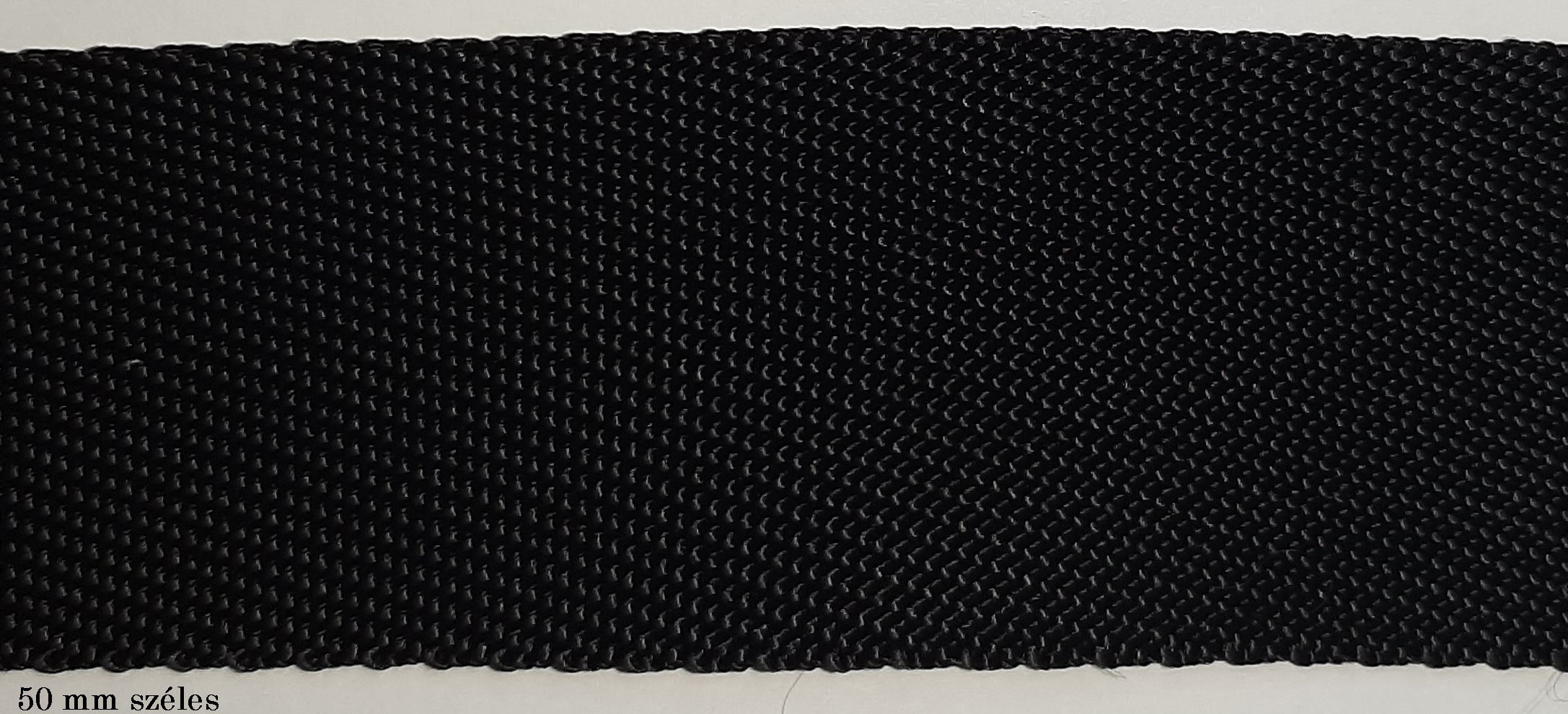 Heveder PP "zsákszövésű" fekete színben, 50 mm széles, 235 Ft/m  (50 m)