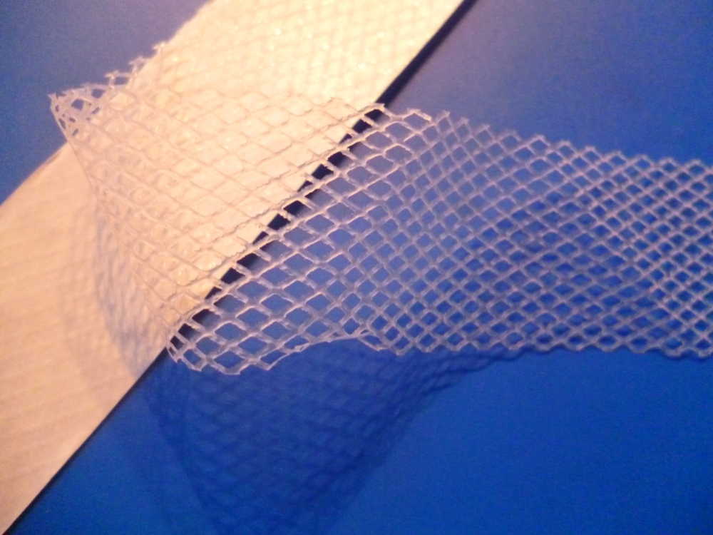 Hártya háló  fátyol vetex 10 mm kétoldalas, vasalható, aljazáshoz. 30 Ft / m